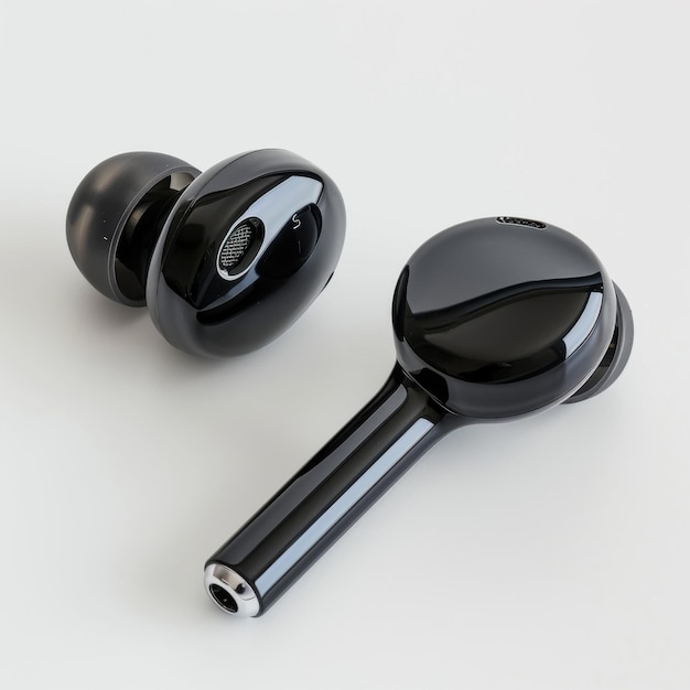 Black wireless earbuds with sleek design on white surface