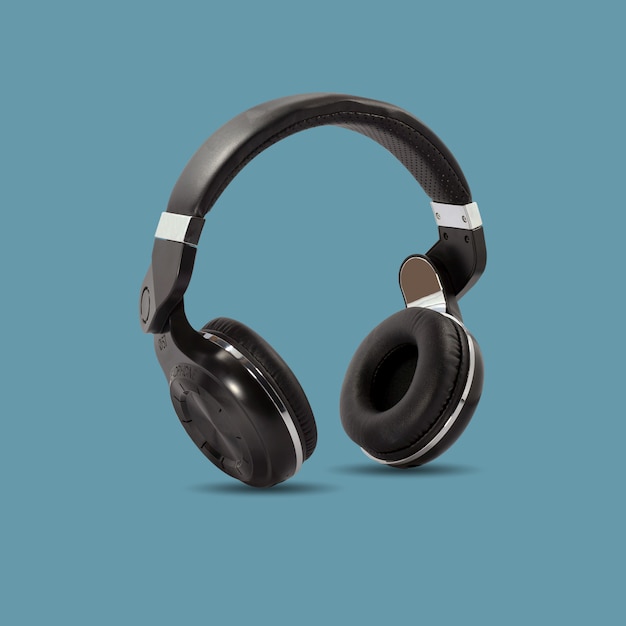 Black wireless headphone isolated on beautiful pastel color