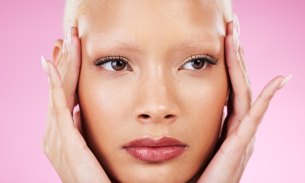 Black woman beauty headshot and hands in studio with facial cosmetics vision or makeup by pink background African gen z model girl and healthy natural glow on skin for wellness aesthetic or care