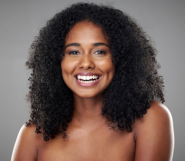 Black woman beauty and smile hair and skin natural cosmetics advertising with skincare and hair care treatment portrait Makeup facial wellness and body care with grey studio background