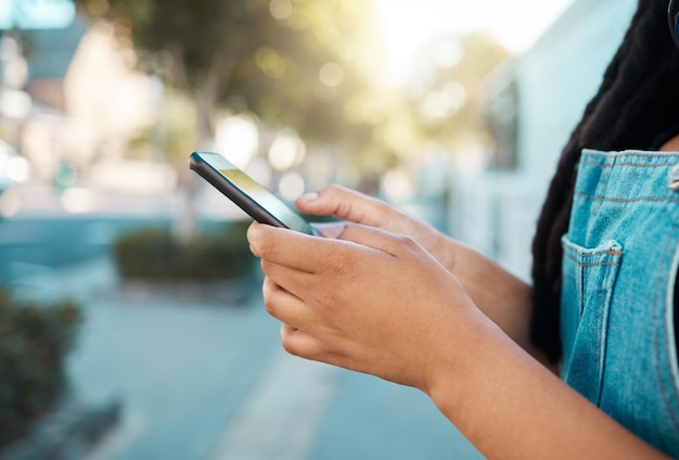 Black woman hands and phone in city travel with gps location tracking social media app and New York map Zoom tourist or fashion student with mobile communication technology in 5g internet search