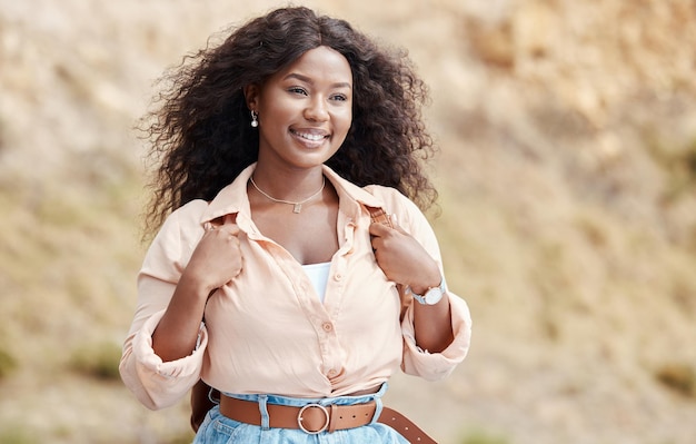 Black woman smile and travel in nature on road trip vacation or holiday in summer Girl happy and backpack to enjoy view outdoor and a break in sunshine to relax safari and rest in countryside