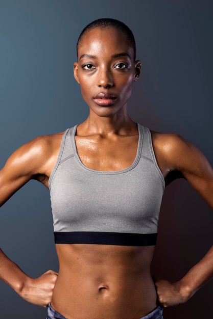 Black woman in sportswear on dark blue background