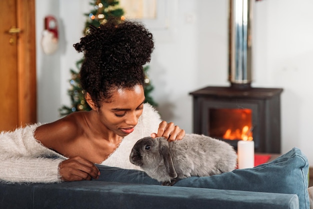 Black woman with rabbit on Christmas