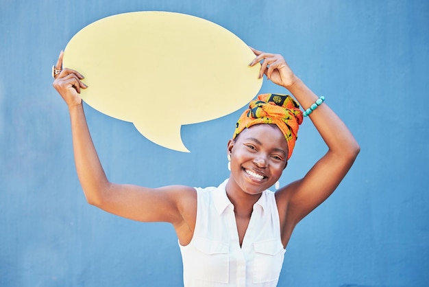 Black woman with speech bubble or mockup for social media advertising marketing or sale communication Blue background brand or startup girl with smile for feedback review vote or voice opinion