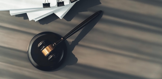 Photo black wooden gavel and paper on office desk as justice and legal equility