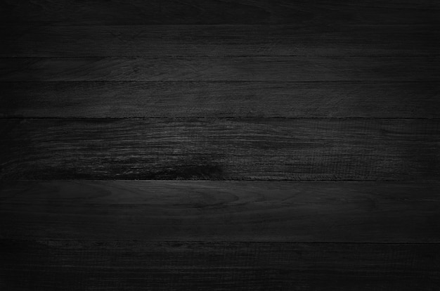 Black wooden wall background, texture of dark bark wood, top view of grain timber.