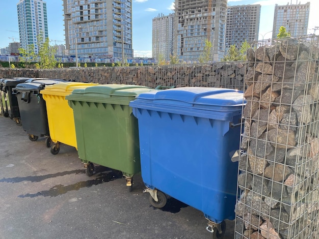 Black yellow green and blue plastic large modern containers for separate collection and subsequent