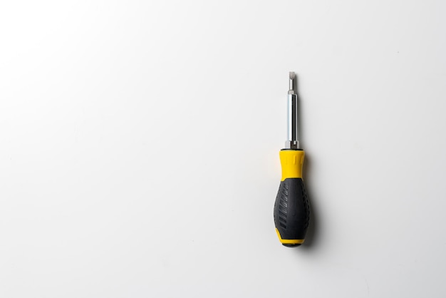 A black and yellow screwdriver isolated repair tool equipment