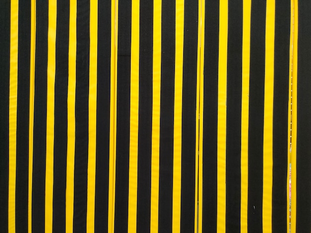 A black and yellow striped fabric with the word " on it. "