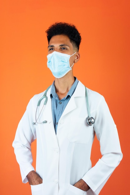 Black Young Doctor or Veterinarian Medical Resident With Stethoscope and Pandemic Mask Isolated