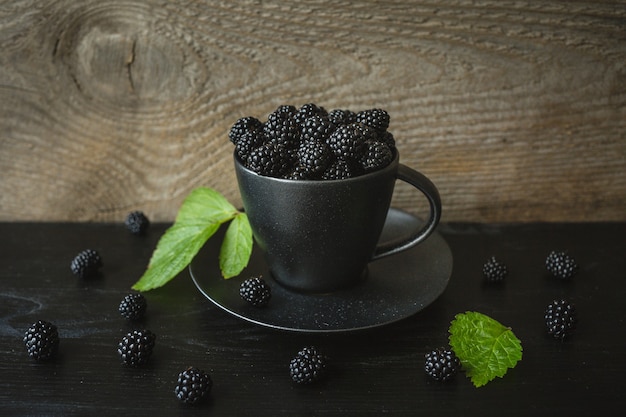 Blackberries, fresh berries, wooden background, vegetarian food