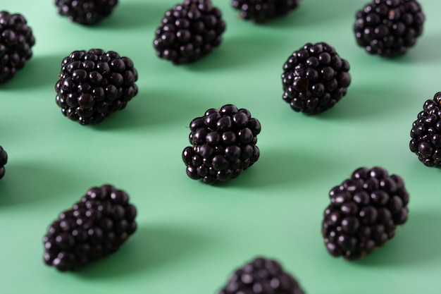 Blackberry pattern on green background