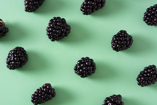 Blackberry pattern on green background