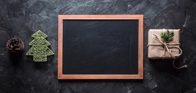 Blackboard and Christmas toy on a black background