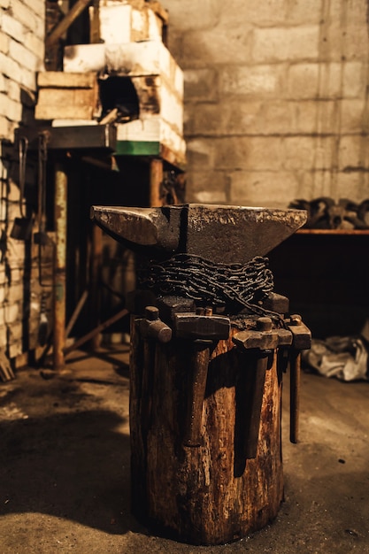 Blacksmith workplace: anvil, hammers, furnace