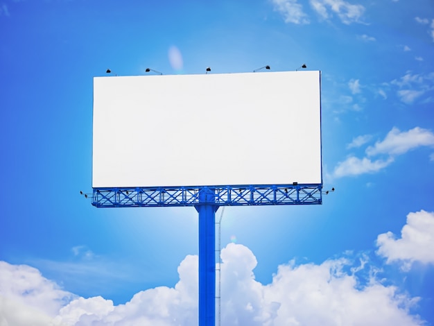 Blank advertisement billboard of blue sky background purposely for adding or applying advertising pictures, graphics, or images on white area