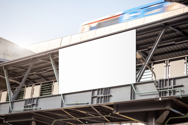 Blank billboard in railway station