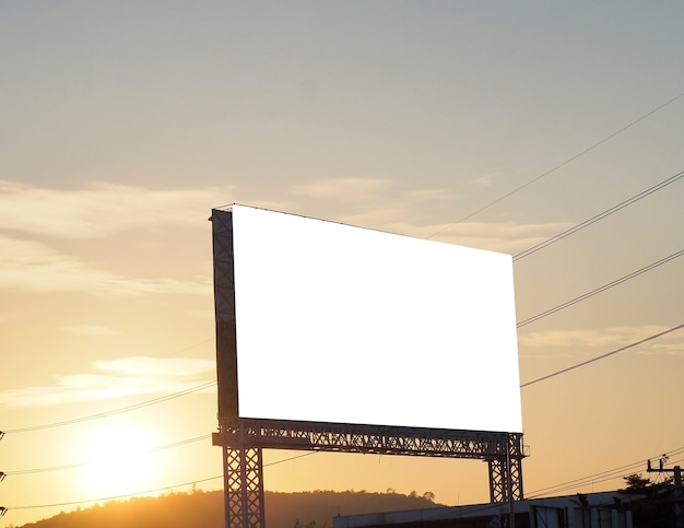 Blank billboard on sunset background for new advertisement