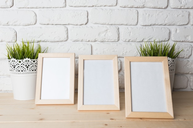 Blank black picture frame on the wall