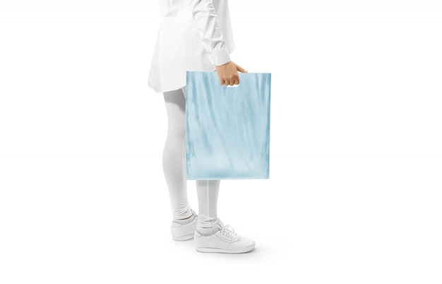 Blank blue plastic bag  holding hand