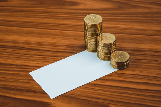 Blank business card or name card and coin stack