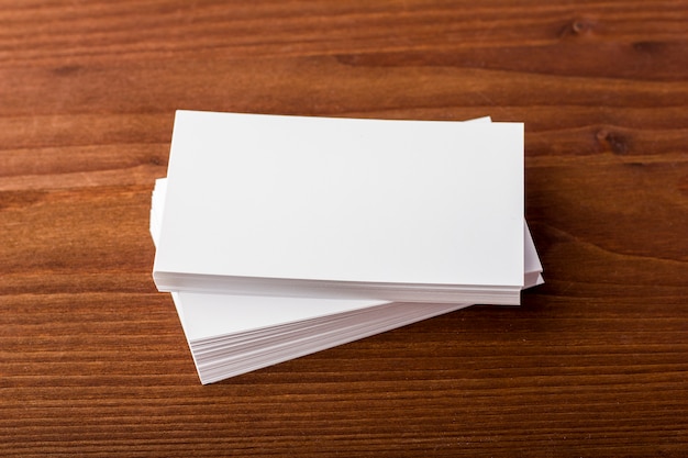 Blank business cards on a wooden background