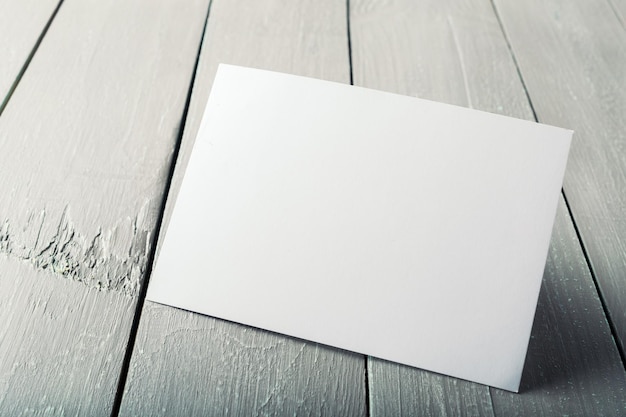 Blank business cards on a wooden background