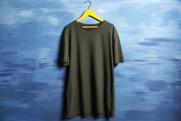 Blank color t-shirt against grunge background