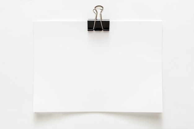 Blank empty sheet of paper attached with clip