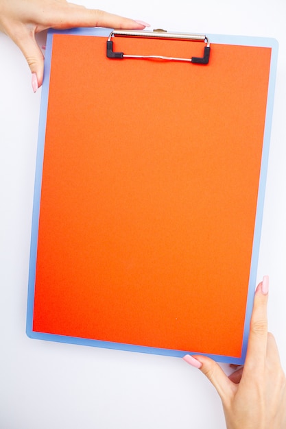 Blank Folder with Red Paper. Hand that Holding Folder and Pen