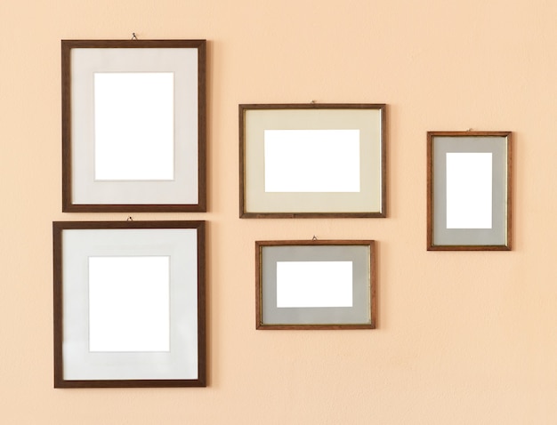 Blank frames on beige wall