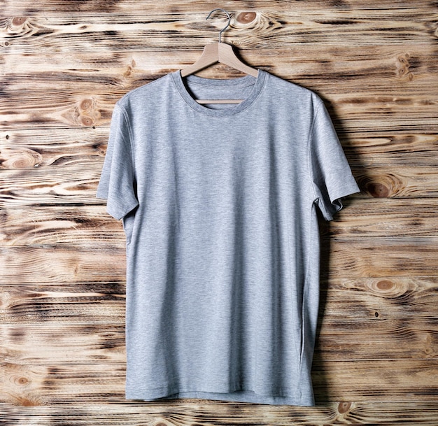 Blank grey tshirt against wooden background