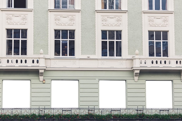 Blank layout of white windows on building outside place for your advertising