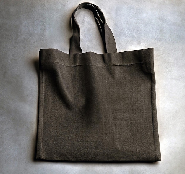 a blank linen black shopper bag on dark background