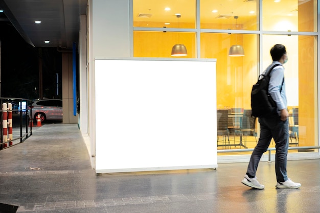 Blank mock up of store street showcase window in a city at night