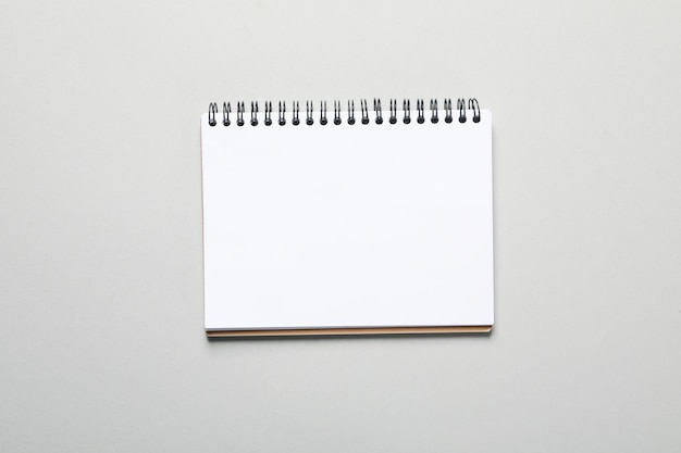 Blank notebook on light gray background space for text