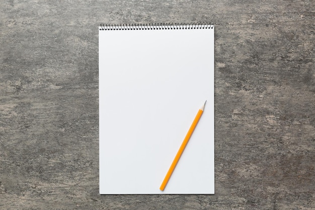 Blank notebook with pen on white background Back to school and education concept