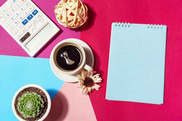 Blank notepad and coffee cup