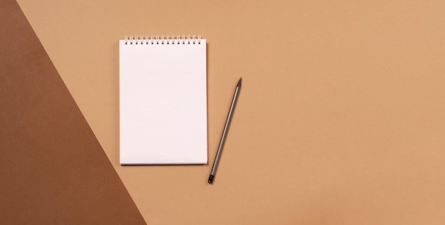 Blank notepad for office or school to write the goals of the task plans flat lay