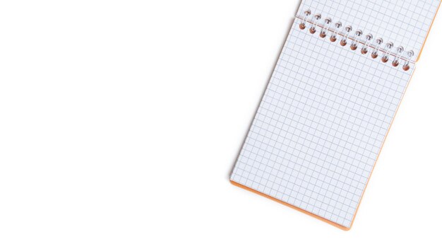 Blank notepad with wire binding on a white background Top view with copy space