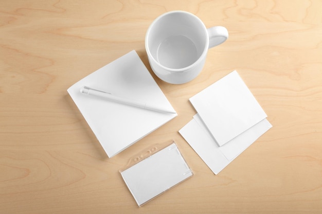 Blank office supplies on wooden background