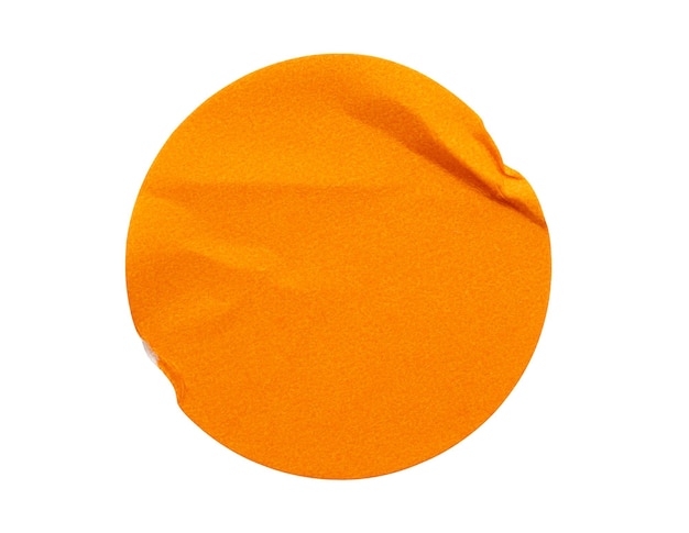 Blank orange round adhesive paper sticker label isolated on white background