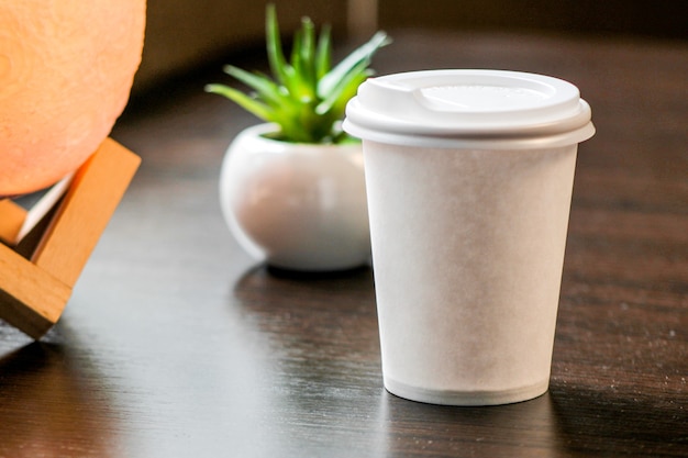 Blank paper coffee cup with plastic cap