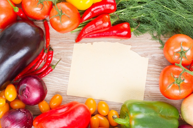 Blank paper note with frame of colorful vegetables