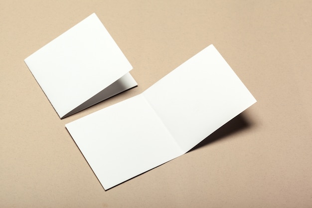 Blank paper pieces on a beige surface