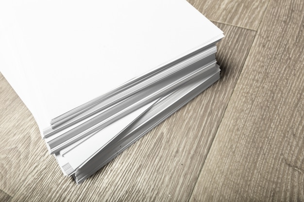 Blank  paper pile on wood