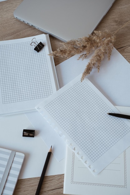 Blank paper sheet on table Artist home office desk workspace with pencil pampas grass To do list Mockup with empty copy space