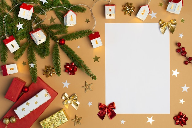 Blank paper for text with christmas decoration on beige background