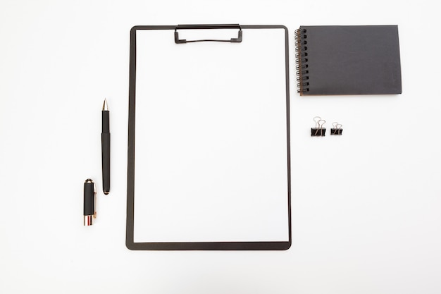 Blank paper on wooden clipboard isolated on white